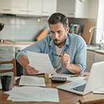 man reviewing financial adjustments after divorce